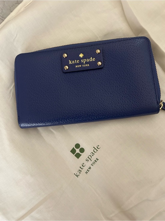 kate spade Handbags - kate spade leather zip-around wallet in deep blue with gold logo